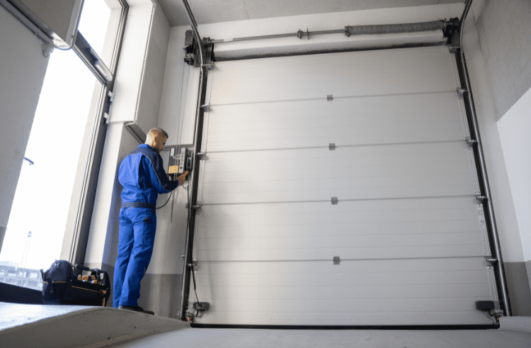 technician performing garage door lube service